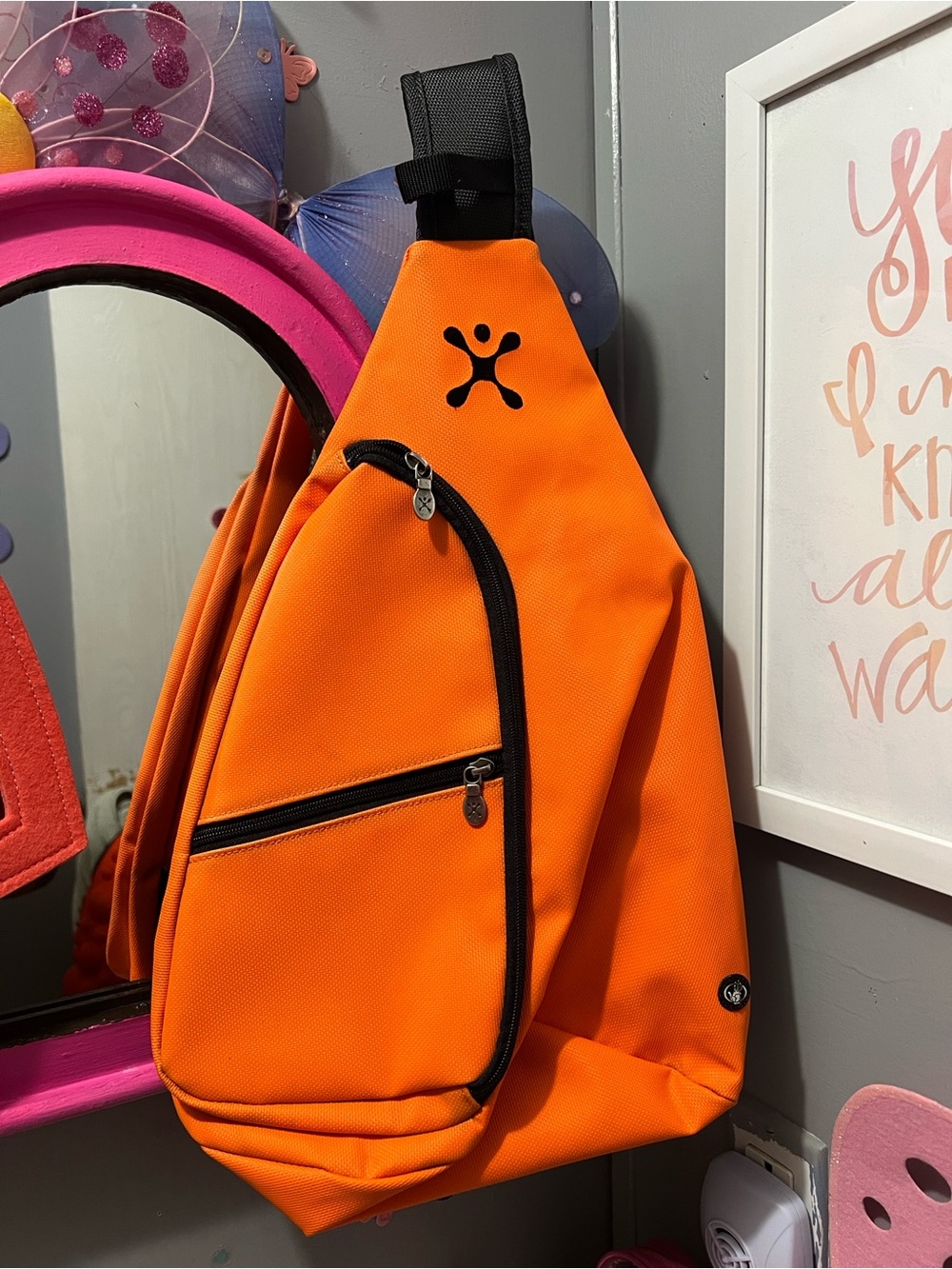 Bright Orange Sling Backpack with Black Trim